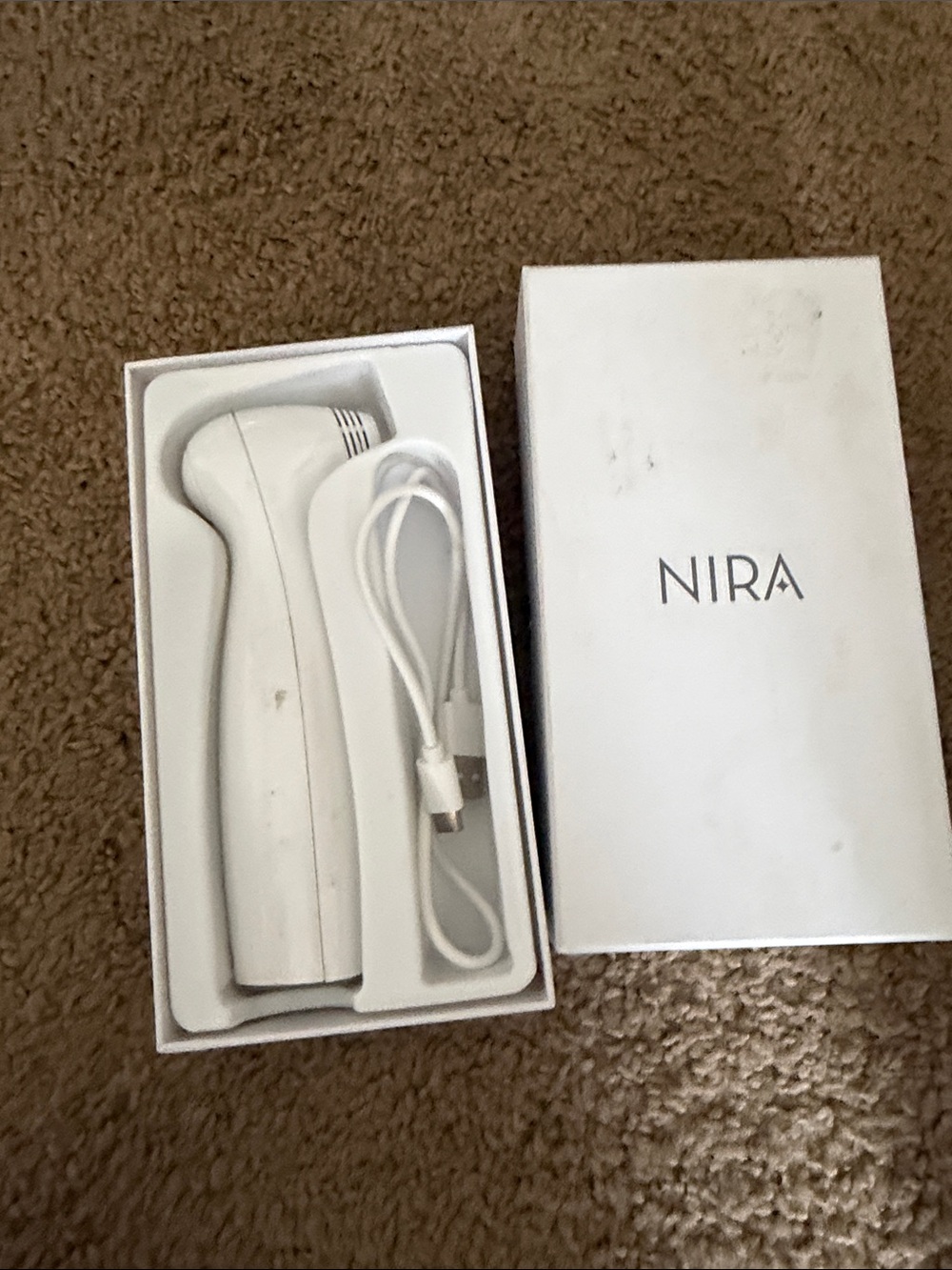 NIRA White Handheld Electronic Skincare Device